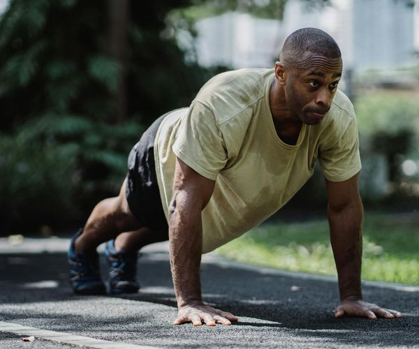 Close up of a man focused on his morning exercise routine.
